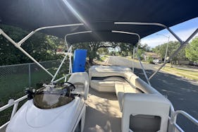 Sun Tracker Pontoon in Lake Austin